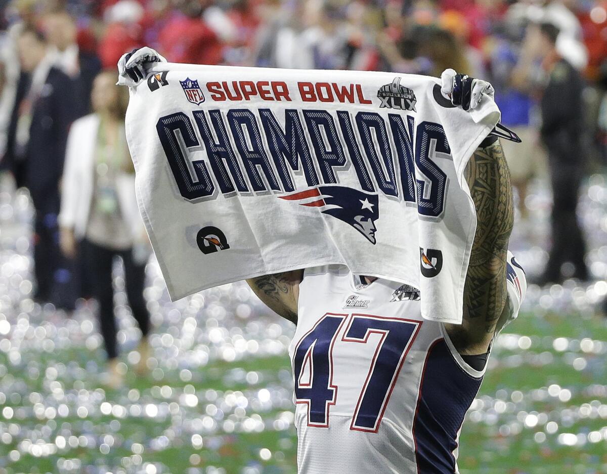 Patriots tight end Michael Hoomanawanui celebrates after winning Super Bowl XLIX on Sunday.