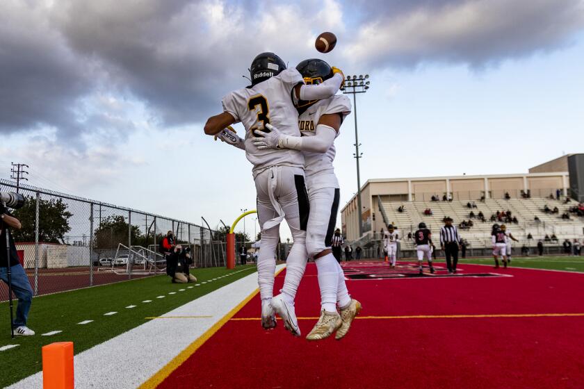 WILMINGTON, CA - APRIL 23, 2021: San Pedro Robert Sarmiento (3) celebrates with Roman Sanchez (8).