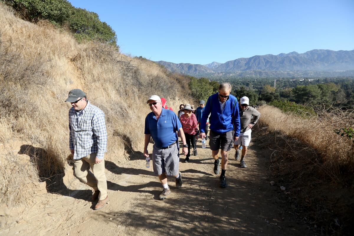 La Cañada Flintridge Mayor Len Pieroni, center, led the fourth annual Mayor's Hike along a 1.5-mile part of the Descanso Trail, in La Cañada Flintridge on Saturday, Nov. 17, 2019.