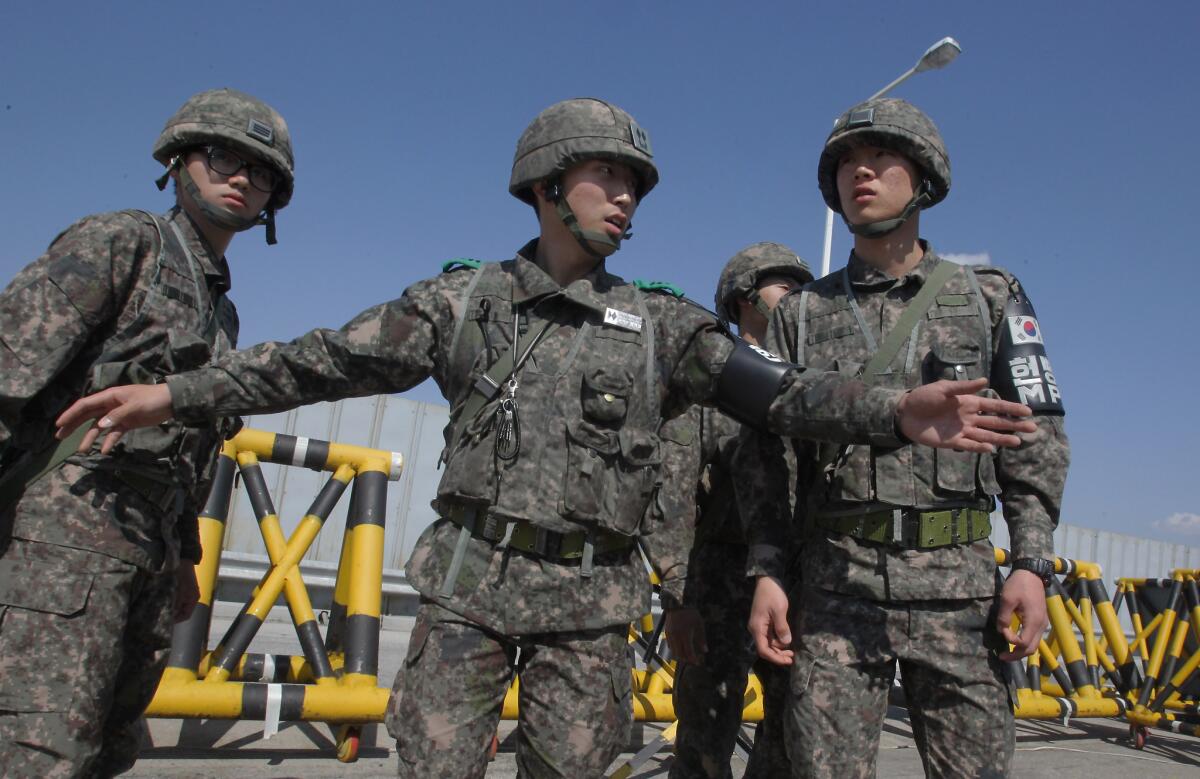 South Korean soldiers stand at a military check point connecting South and North Korea at the Unification Bridge in Paju, South Korea.