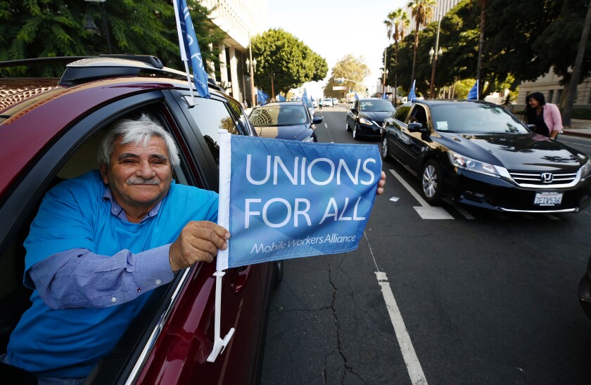 la-photos-1staff-469109-la-me-uber-lyft-minimum-wage-debate-2-als-230539589