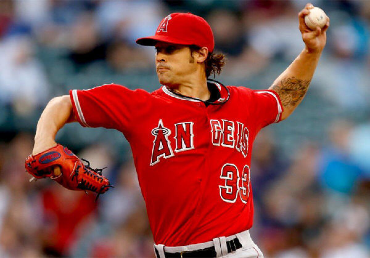Angels starter C.J. Wilson pitches against the Seattle Mariners.