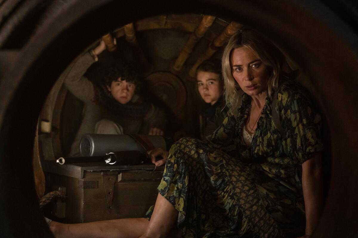Noah Jupe, from left, Millicent Simmonds and Emily Blunt in "A Quiet Place Part II."