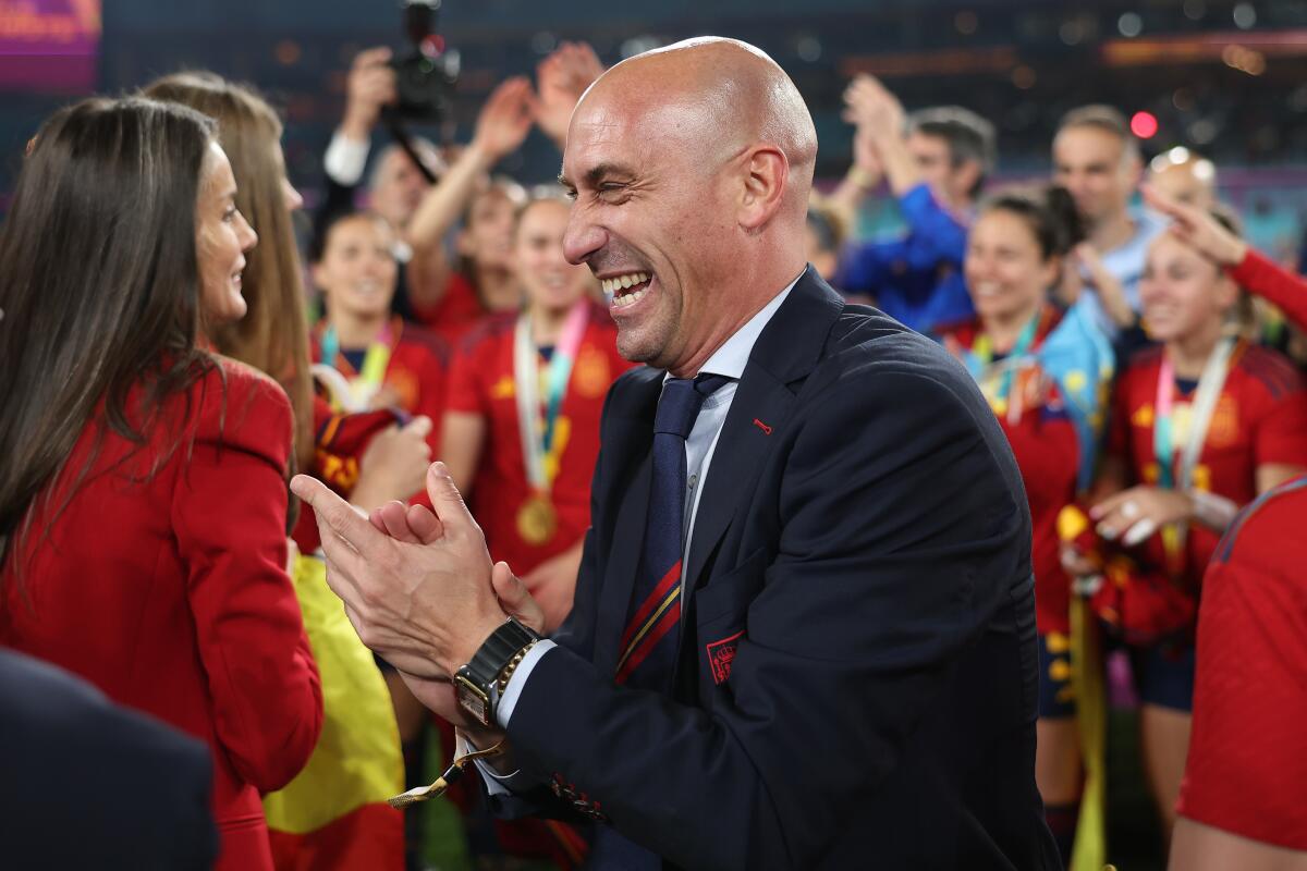 Luis Rubiales, president of the Spanish soccer federation, celebrates with team members on the field