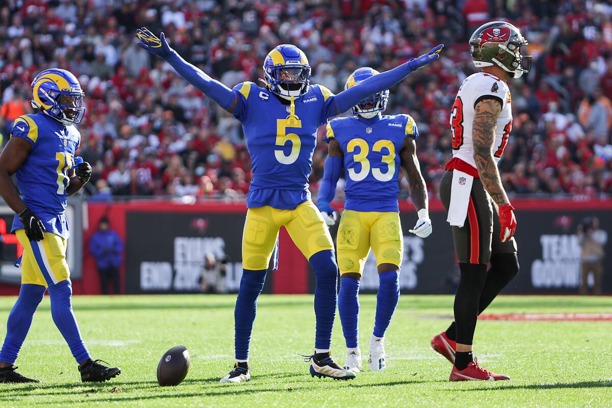 Jalen Ramsey raises his arms to signal no catch as Tampa's Mike Evans walks away 