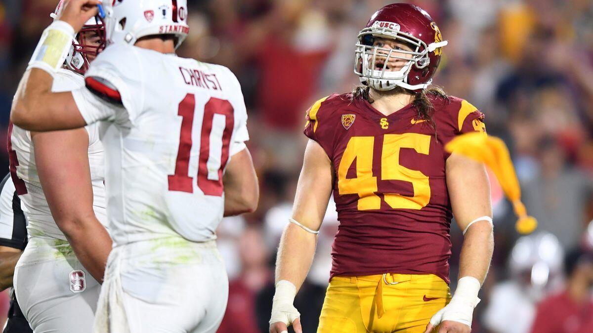 USC linebacker Porter Gustin is called for a roughing the passer penalty on a false start by Stanford in the third quarter at the Coliseum on Saturday.