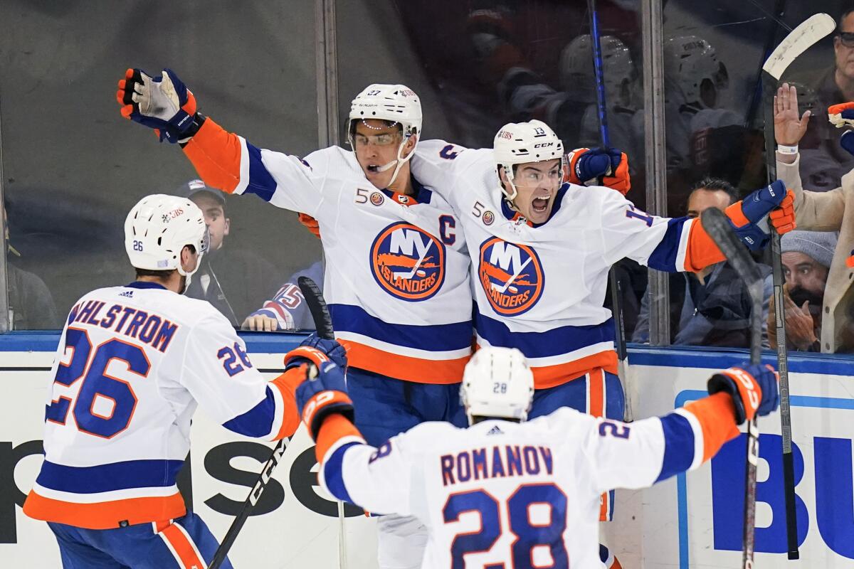 Islanders score 3 in 3rd to rally past rival Rangers 4-3