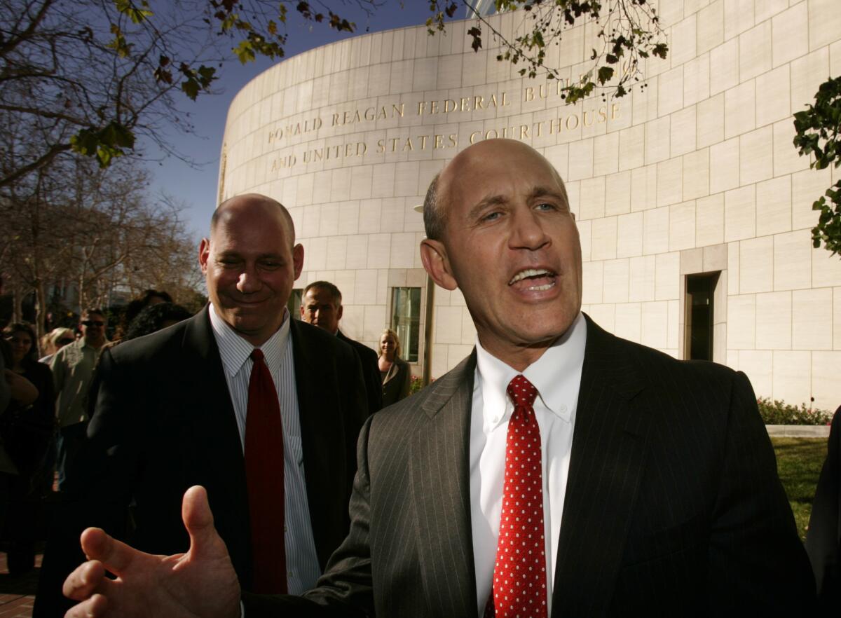 Former Orange County Sheriff Mike Carona speaks outside federal court in Santa Ana in 2009.