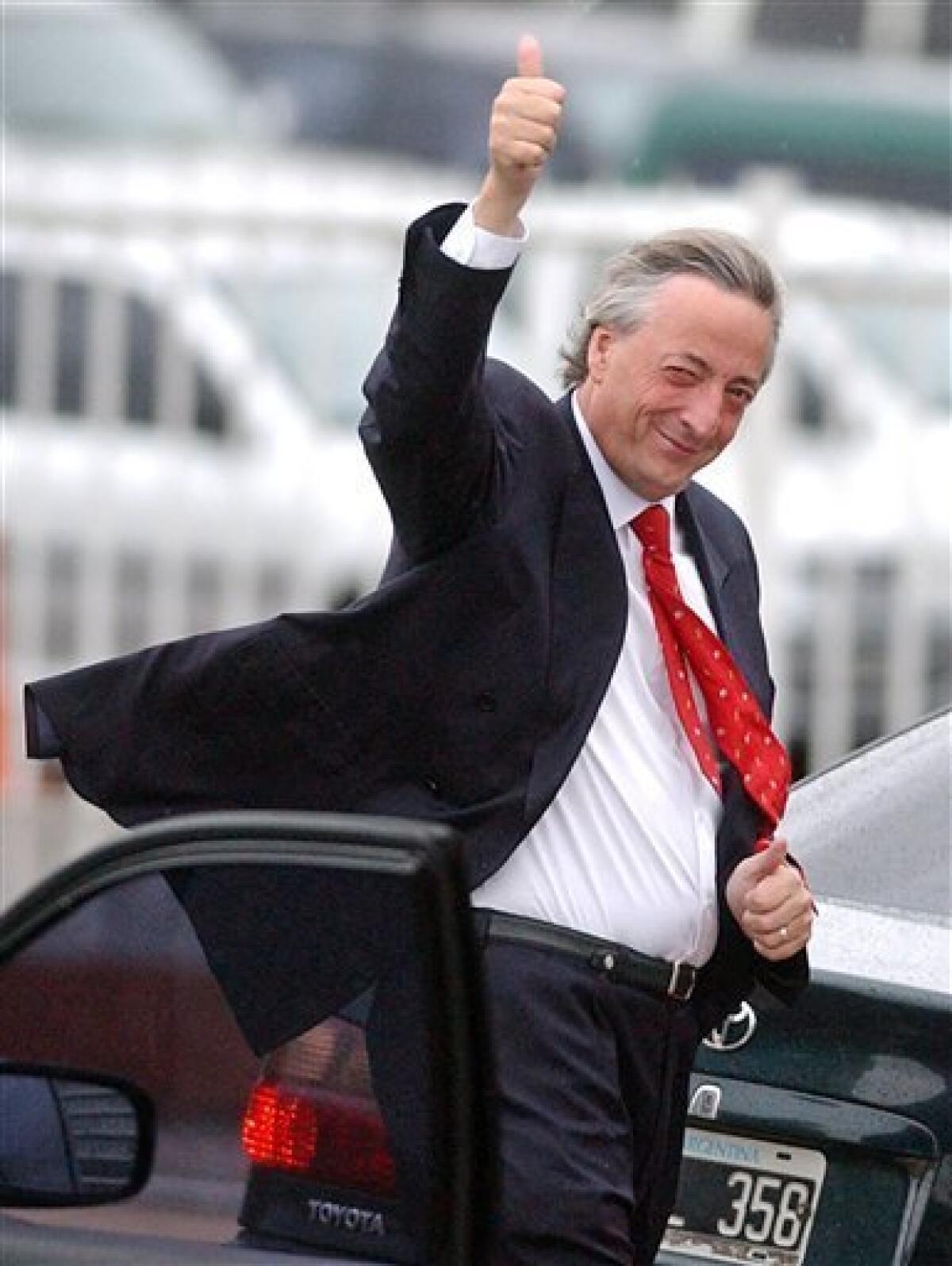 FILE - In this Oct. 24, 2005 file photo, Argentina's President Nestor Kirchner gives a thumbs-up as he arrives to the government house in Buenos Aires, Argentina. Kirchner, who served as Argentina's president from 2003-2007, died on Wednesday Oct. 27, 2010 after suffering heart attacks at age 60. (AP Photo/Leonardo Zavattaro, Telam, File)