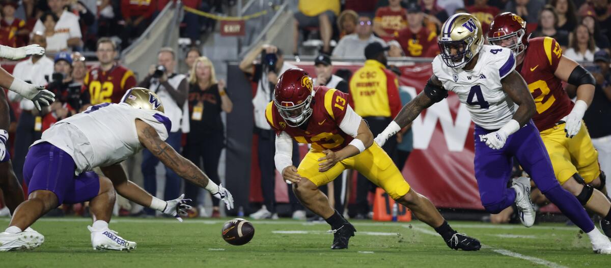 USC quarterback Caleb Williams loses the ball on a fumble during the second quarter against Washington.