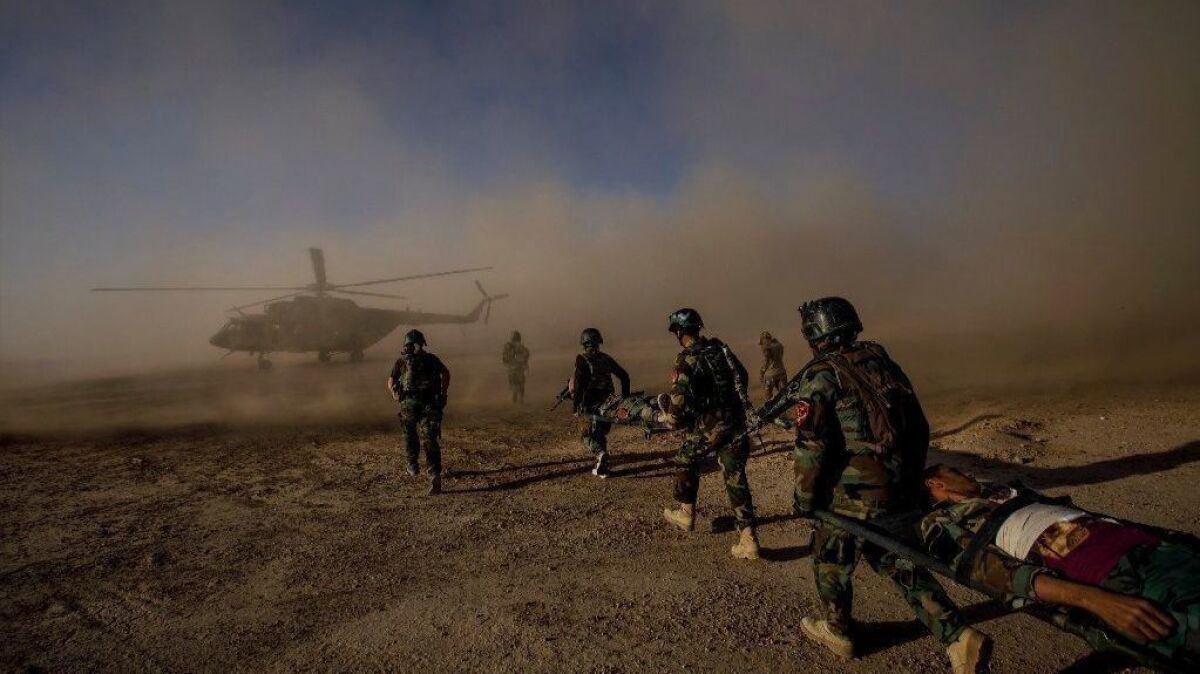 Afghan army commandos participate in a casualty evacuation training exercise near Camp Shorab, in Helmand province, in 2017.