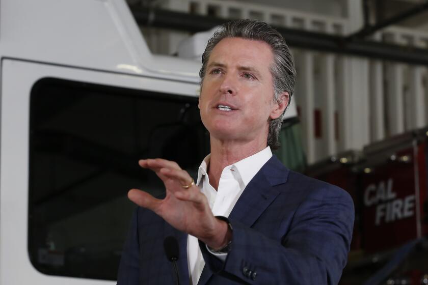 Gov. Gavin Newsom discusses his revised state budget proposal during a news conference at the CalFire/Cameron Park Fire Station in Cameron Park, Calif., Wednesday, May 13, 2020. Los Angeles County reopened its beaches Wednesday in the latest cautious easing of coronavirus restrictions that have closed most California public spaces and businesses for nearly two months. (AP Photo/Rich Pedroncelli, Pool)