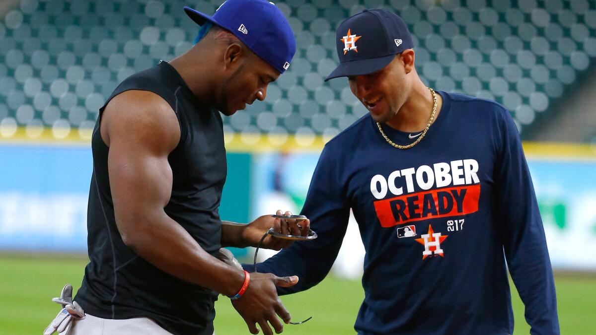 The Dodgers' Yasiel Puig, left, and the Astros' Yuli Gurriel before Game 3.