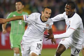 US midfielder Landon Donovan celebrates his goal with teammate striker Edson Buddle during the Group C, first round, 2010 World Cup football match USA vs. Algeria on June 23, 2010 at Loftus Verfeld stadium in Tshwane/Pretoria. Lacen received a yellow card for the tackle. NO PUSH TO MOBILE / MOBILE USE SOLELY WITHIN EDITORIAL AFP PHOTO / TIMOTHY A. CLARY (Photo credit should read TIMOTHY A. CLARY/AFP/Getty Images)