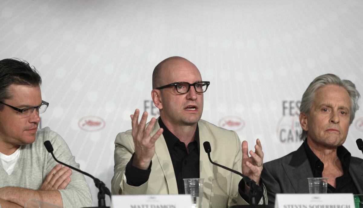 From left, Matt Damon, Steven Soderbergh and Michael Douglas at a news conference in Cannes, France, for the film "Behind the Candelabra."