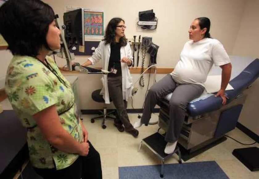 A prenatal exam is performed at the North Portland Health Center in Portland, Ore. Healthcare jobs are expected to boom by 2020, but most unemployed Americans won't have the schooling necessary to land them.