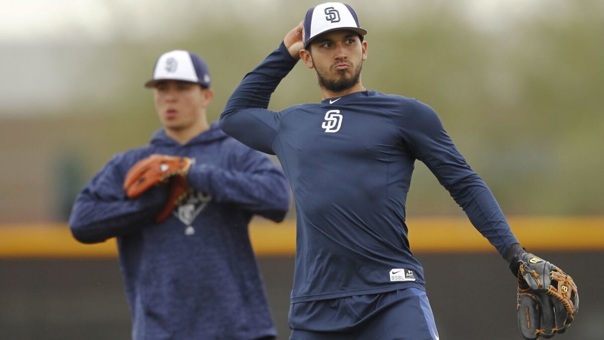 San Diego Padres Javier Guerra fields the ball during spring training in Peoria on Feb. 14, 2018.