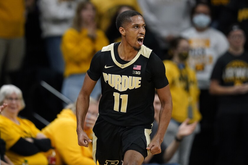 Purdue guard Isaiah Thompson (11) celebrates after making a 3-point basket during the second half of an NCAA college basketball game against Iowa, Thursday, Jan. 27, 2022, in Iowa City, Iowa. (AP Photo/Charlie Neibergall)