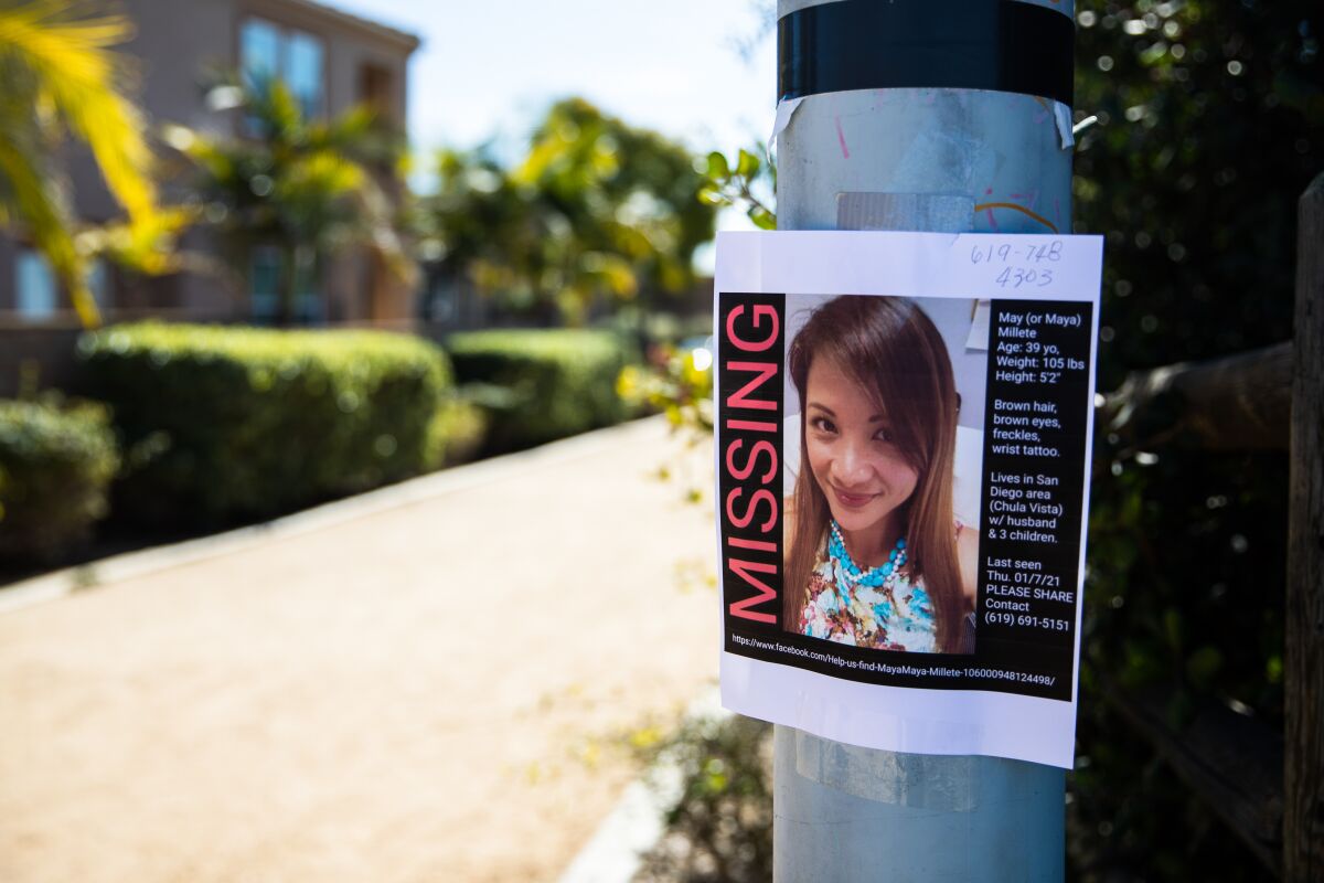 Sign about disappearance of Maya “May” Millete taped to a utility pole