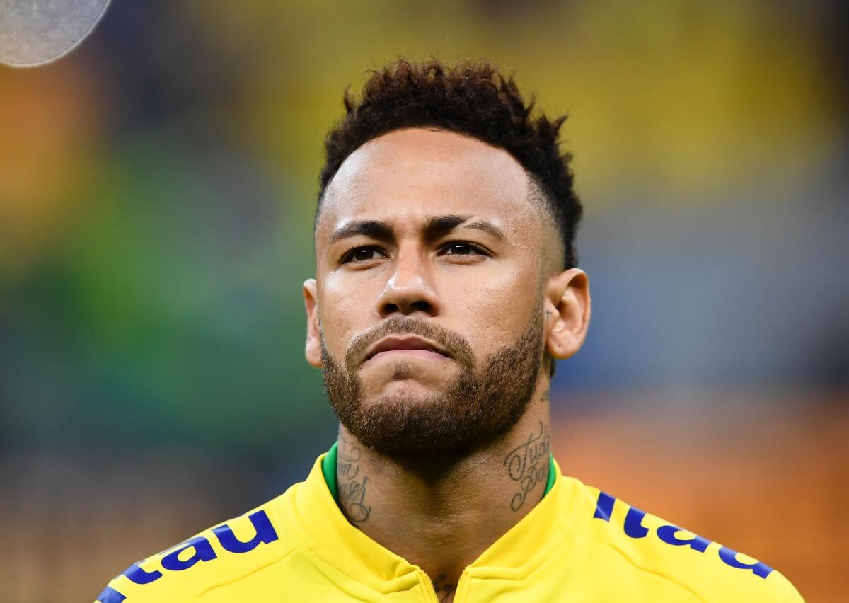 (FILES) In this file photo taken on June 06, 2019 Brazil's Neymar warms up before a friendly football match against Qatar at the Mane Garrincha stadium in Brasilia, ahead of Brazil 2019 Copa America. Neymar was included on August 16, 2019 in Brazil's squad for friendlies against Colombia and Peru next month amid speculation of a departure from Paris Saint-Germain and a return to La Liga. (Photo by EVARISTO SA / AFP)EVARISTO SA/AFP/Getty Images ** OUTS - ELSENT, FPG, CM - OUTS * NM, PH, VA if sourced by CT, LA or MoD **