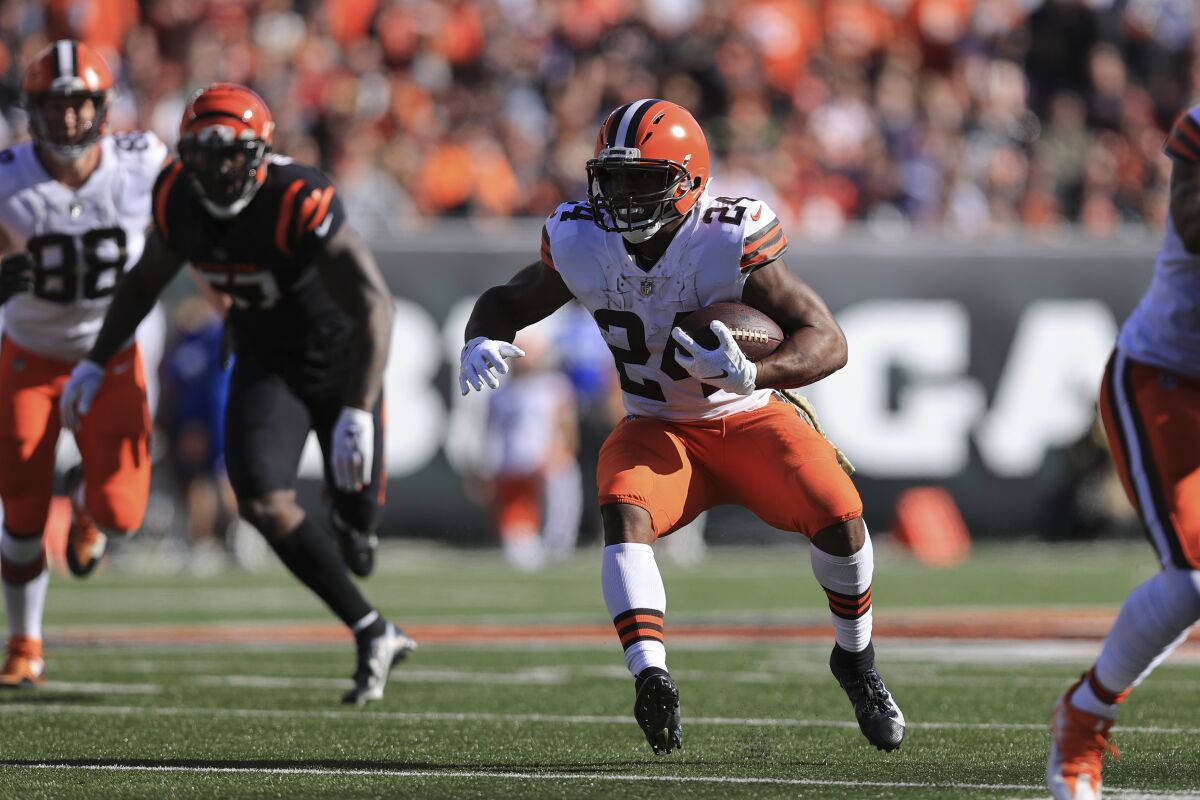 Cleveland Browns' Nick Chubb (24) runs during the first half of an NFL football game against the Cincinnati Bengals, Sunday, Nov. 7, 2021, in Cincinnati. (AP Photo/Aaron Doster)