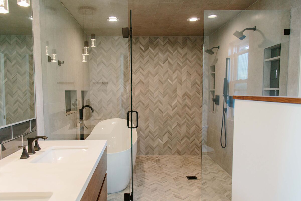 In a spa-like “wet room” master bathroom in Point Loma, Raj Swenson took the floor tile all the way to the ceiling. 