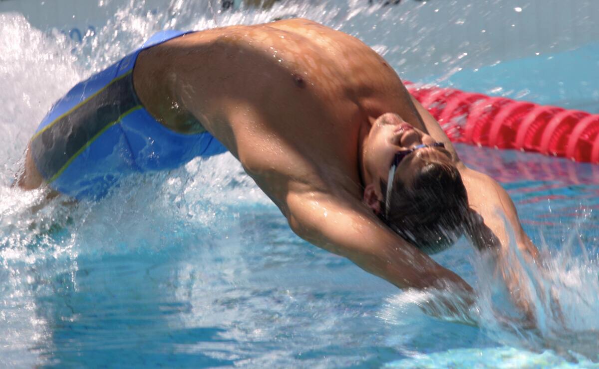 Lenny Krayzelburg competes in the men's 400 medley relay during the 2004 Olympics in Athens.