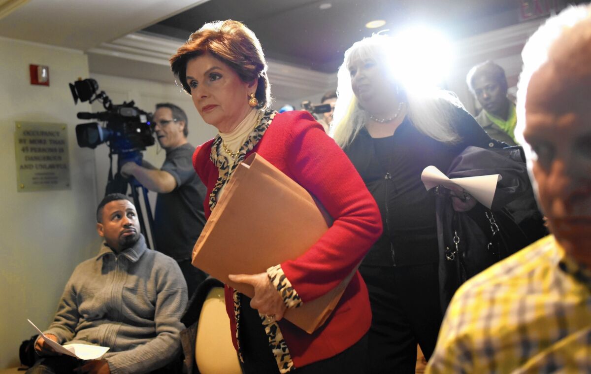 Attorney Gloria Allred walks into a New York news conference with two women who allege they were victims of sexual misconduct by comedian Bill Cosby.