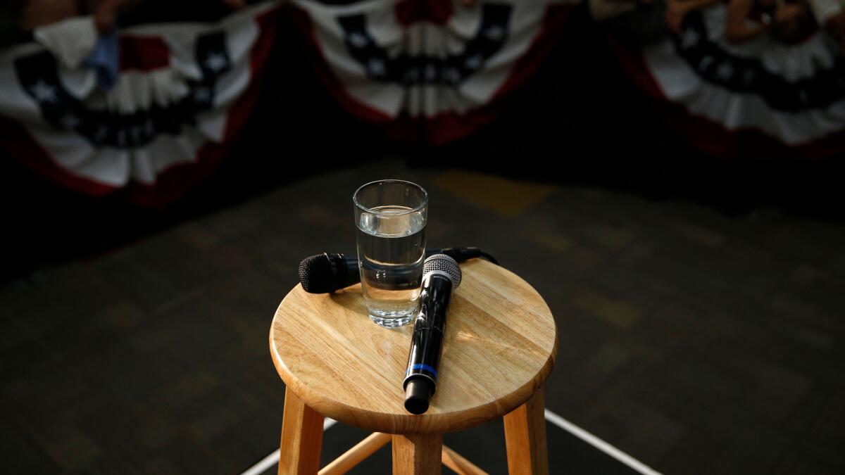 Microphones and a glass of water used by Democratic presidential candidate Hillary Clinton sit on a stool after she spoke at a United Food and Commercial Workers International Union hall on May 25 in Buena Park, Calif.