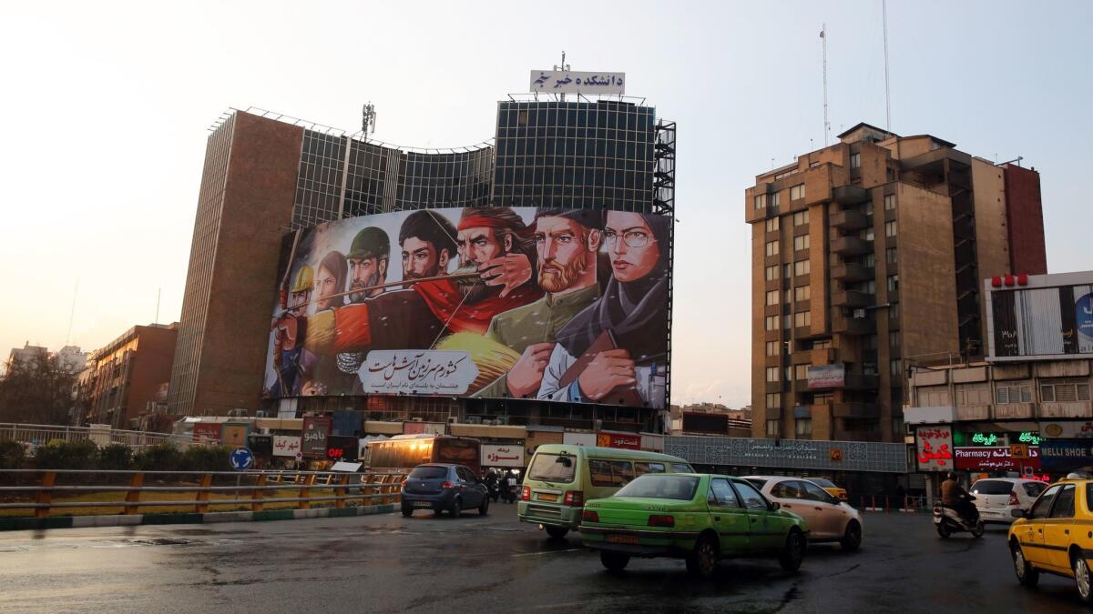 Iranians drive past Vali-Asr square Jan. 7 in Tehran. Media reported that after several days of anti-regime protests, the situation on the streets is back to normal.