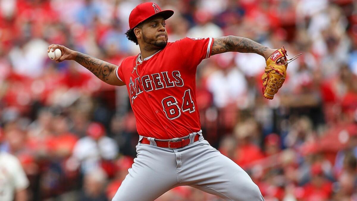 Angels pitcher Felix Pena works during one of his four innings against the Cardinals during their game Saturday.