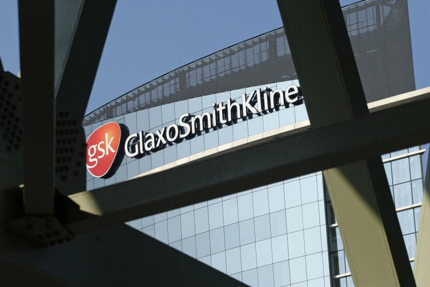 FILE - This April 20, 2009 file photo, shows the British pharmaceuticals firm GlaxoSmithKline in London. Drugmakers GlaxoSmithKline and Pfizer are merging their healthcare divisions, creating a business with combined sales of 9.8 billion pounds ($12.7 billion). British-based Glaxo will own 68 percent of the joint venture, while U.S.-based Pfizer will own the remaining 32 percent stake. (AP Photo/Sang Tan, File)