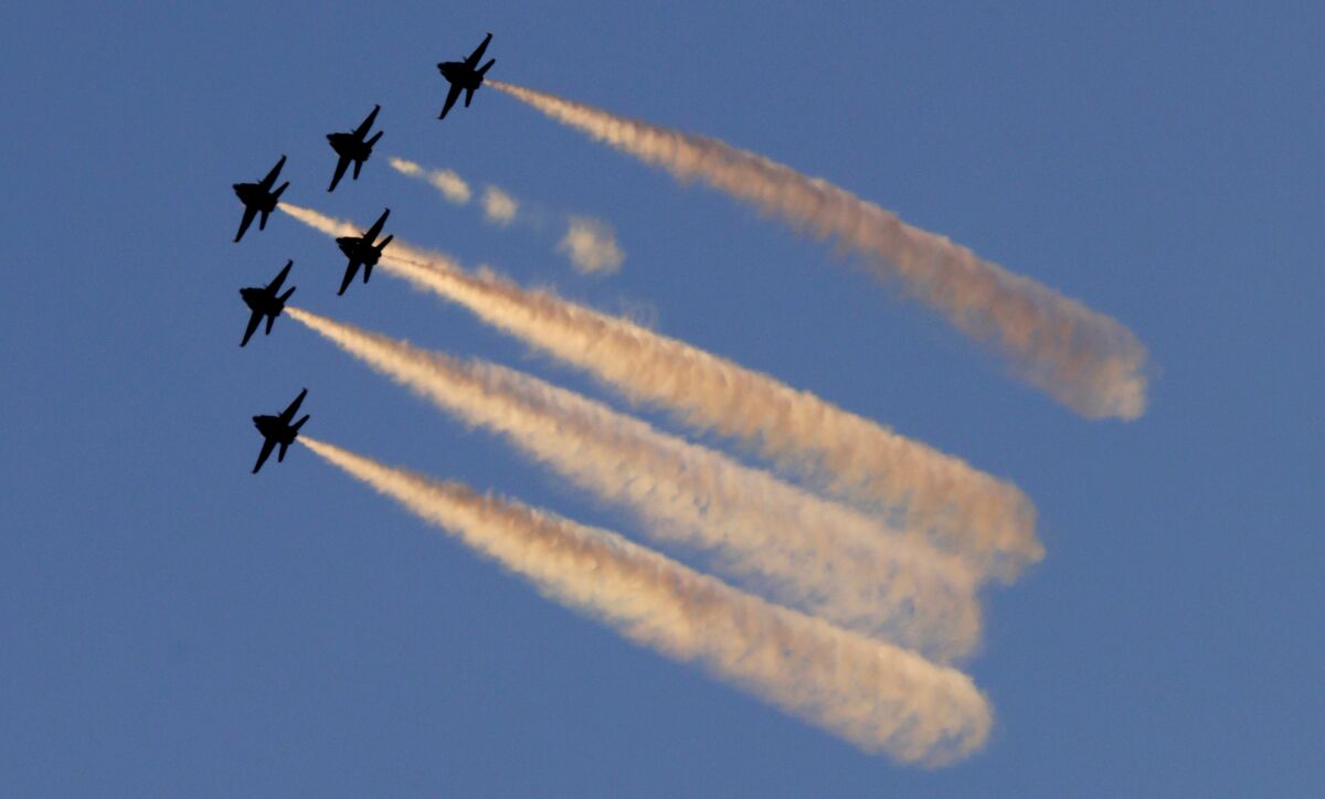 The Blue Angels fly over San Pedro Sunday evening.