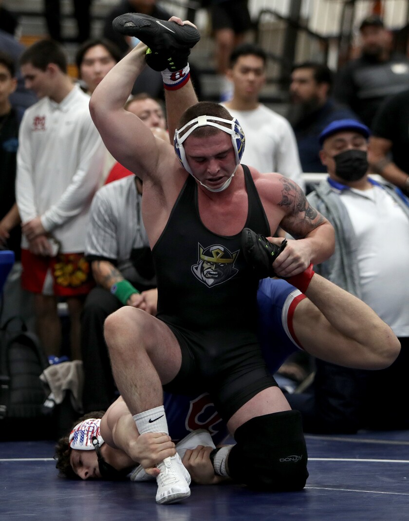 Fountain Valley's TJ McDonnell, top, wrestles Buchanan's Joseph Martin in the 182-pound championship final.