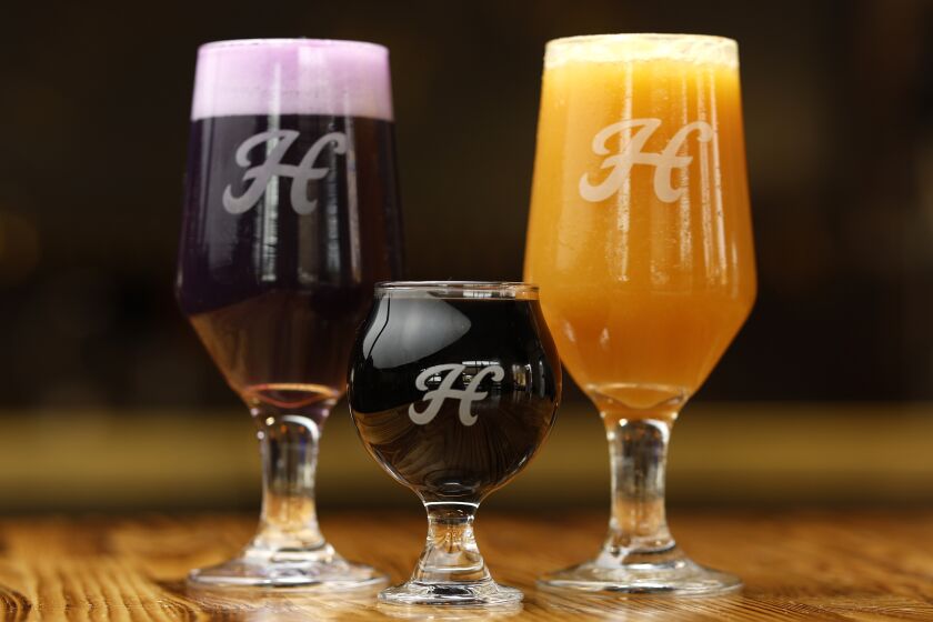 San Diego CA - December 28: Harland Brewing's Ube Milkshake IPA, left, Triple Nilla Imperial Stout, and Miami Fluff Smoothie Style Sour Ale shown on Wednesday, December 28, 2022. (K.C. Alfred / The San Diego Union-Tribune)