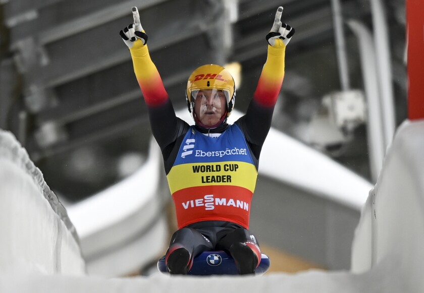 Felix Loch from Germany is happy about his victory at the Luge World Cup in Oberhof, Germany, Saturday, Jan. 16, 2021. (Hendrik Schmidt/dpa via AP)