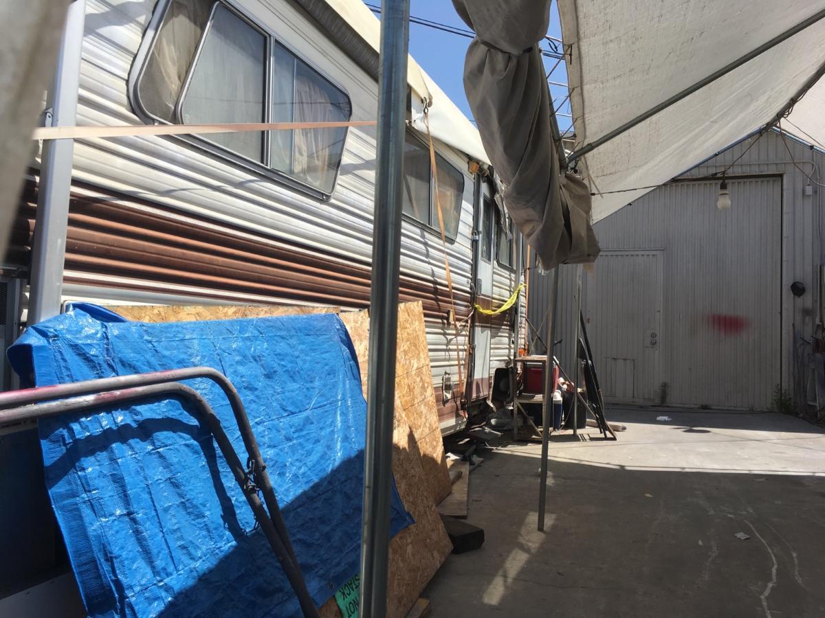 Yellow police tape is draped across the entrance Thursday to what neighbors identified as the motor home where Rodolfo Montoya lived in Huntington Beach.
