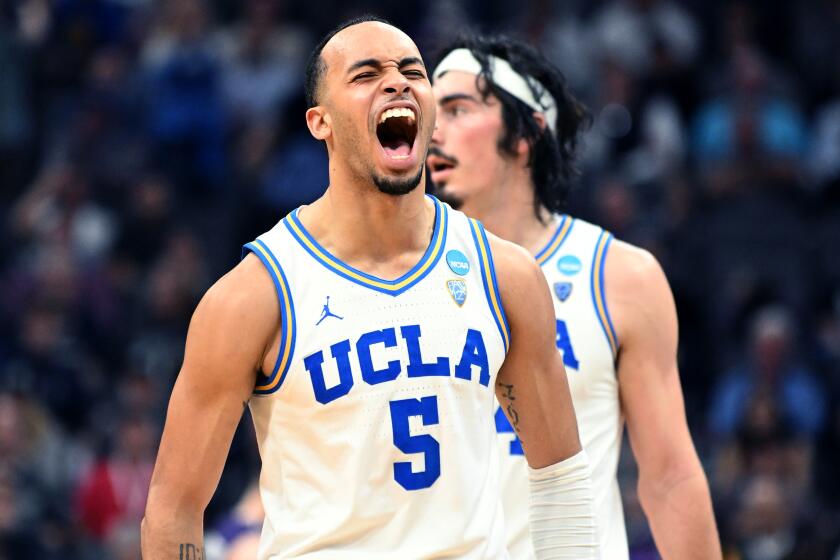 Sacramento California March 16, 2023-UCLA's Amari Bailey celebrates in the final minute.