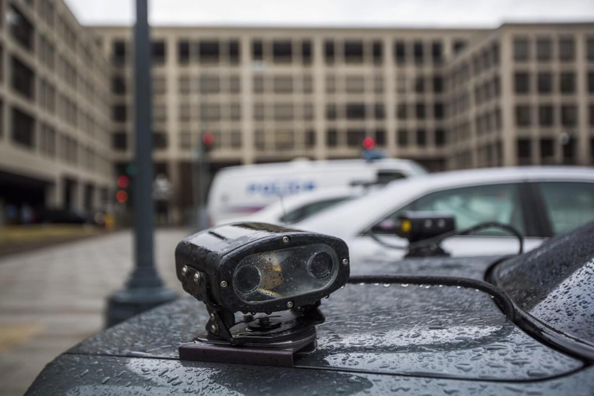 An automated license plate reader is mounted to the back of a police car in Washington.
