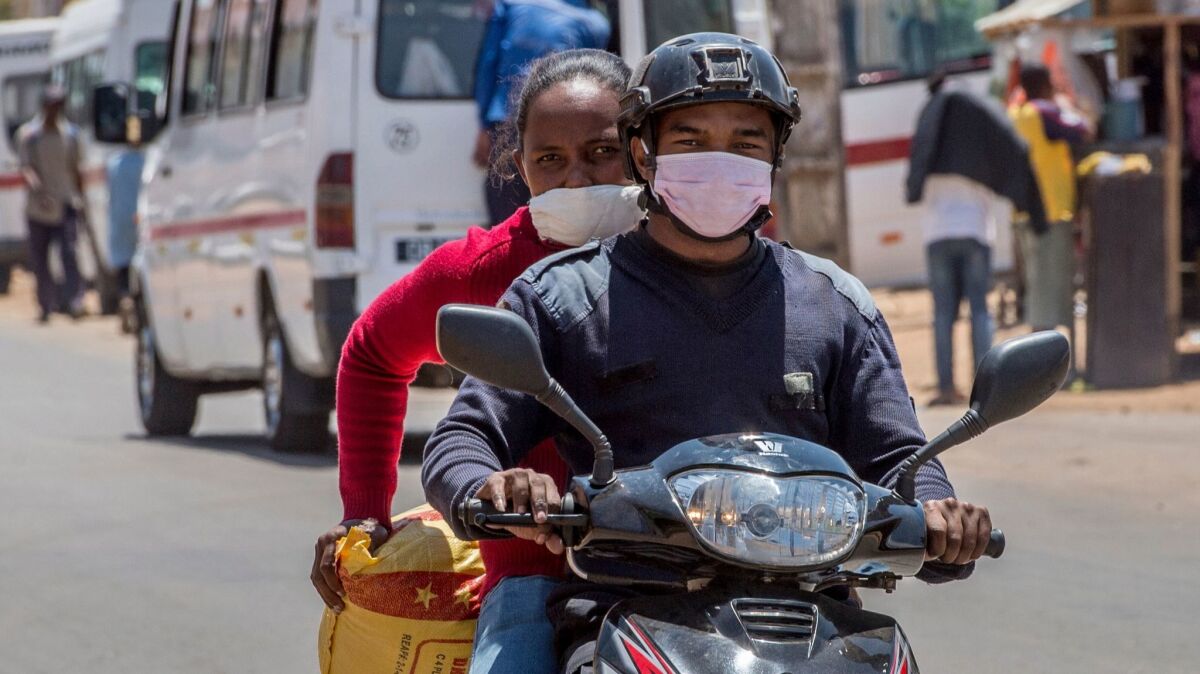 In Madagascar's capital, Antananarivo, people are buying masks to protect themselves against the plague outbreak.