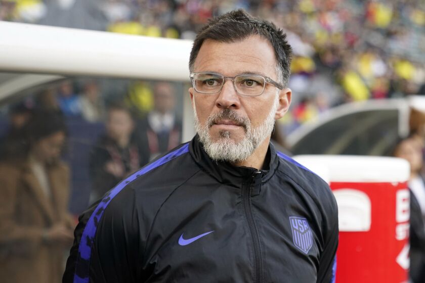 United States head coach Anthony Hudson stands near the bench before an international friendly soccer match against Colombia Saturday, Jan. 28, 2023, in Carson, Calif. Hudson will remain as interim head coach of the U.S. national soccer team through the CONCACAF Gold Cup. The U.S. Soccer Federation said Wednesday, May 24, 2023, it intends to hire a coach by the end of the summer. Hudson was appointed interim coach on Jan. 4, four days after coach Gregg Berhalter's contract expired. (AP Photo/Marcio Jose Sanchez, File)