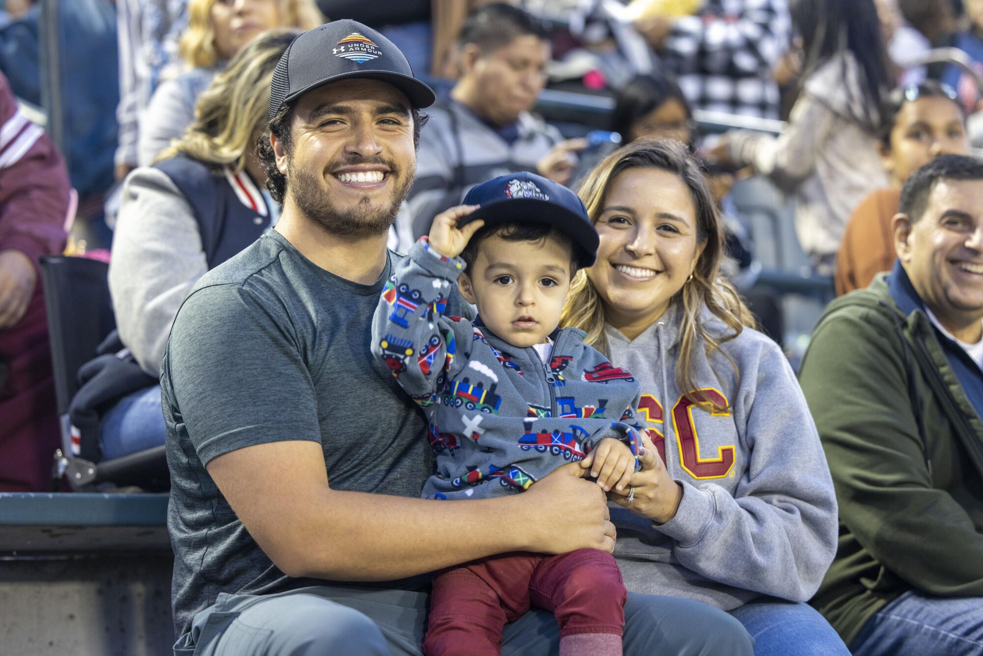 Andres Arellanes and his wife, Isabella, brought their young son to his first East L.A. Classic football game.