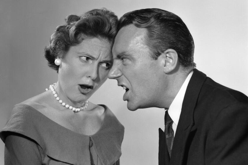 1950s ARGUING COUPLE YELLING AT EACH OTHER FOREHEADS TOUCHING (Photo by Debrocke/ClassicStock/Getty Images)