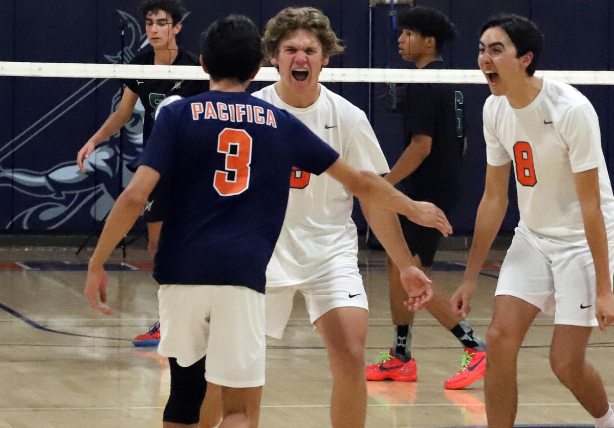 Pacifica Christian's Caleb Unkrich (3), Callen Bray and Kallai Kumar (8) celebrate a point against Sage Hill on Friday.