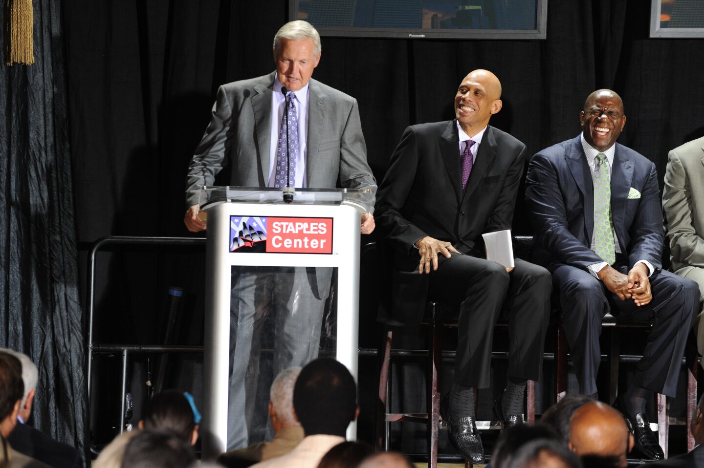 Jerry West speaks next to Kareem Abdul-Jabbar and Magic Johnson on Nov. 16, 2012, at Staples Center.