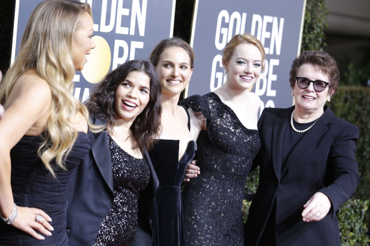 Black is the color of the evening at Sunday's Golden Globes. From left are Mariah Carey, America Ferrera, Natalie Portman, Emma Stone and Billie Jean King, whom Stone portrayed in "Battle of the Sexes."