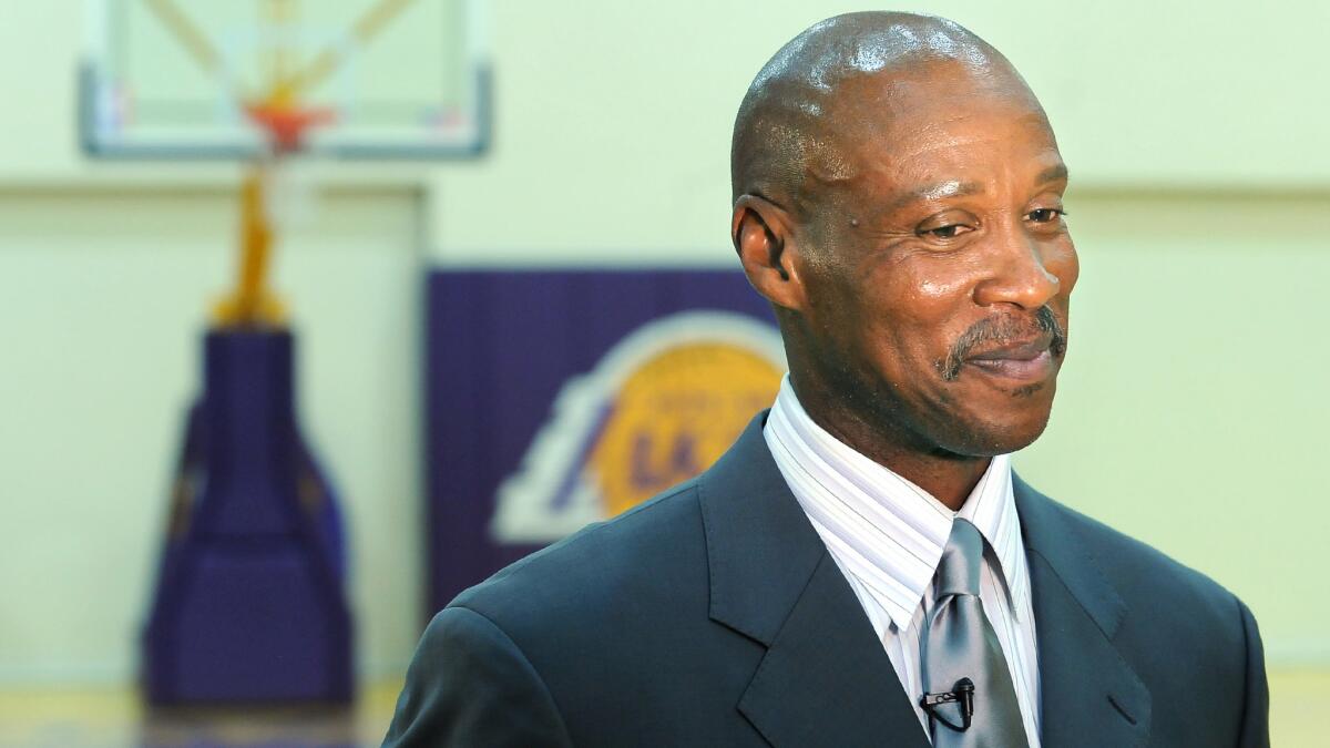 Lakers Coach Byron Scott looks on during his introductory news conference in July. The Lakers announced Scott's coaching staff Tuesday.