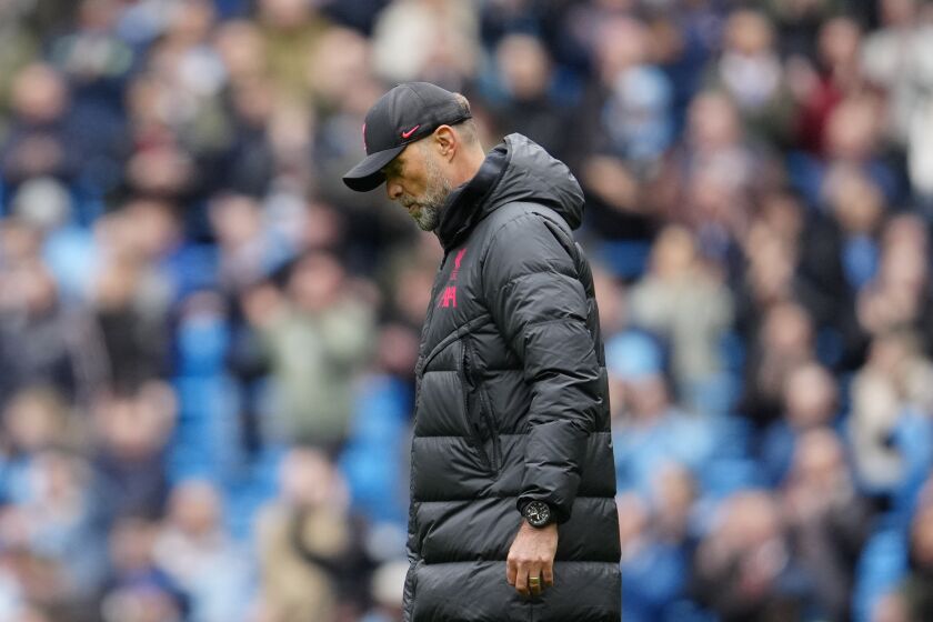 Liverpool's manager Jurgen Klopp leaves the field after losing 1-4 against Manchester City during the English Premier League soccer match between Manchester City and Liverpool at Etihad stadium in Manchester, England, Saturday, April 1, 2023. (AP Photo/Jon Super)
