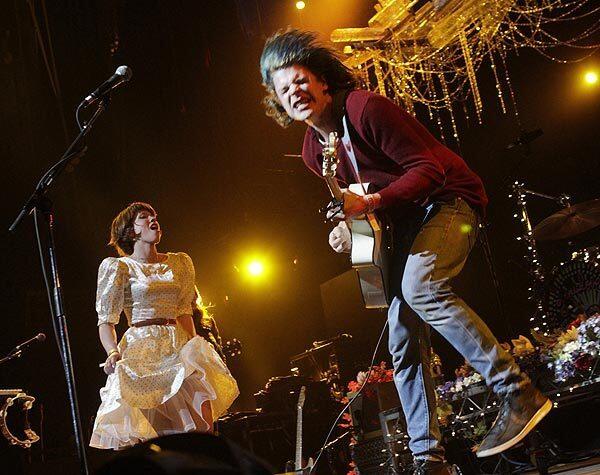Christian Zucconi, right, and Hannah Hooper of Grouplove perform at the second day of KROQ-FM's annual Almost Acoustic Christmas concert Sunday at the Gibson Amphitheatre.