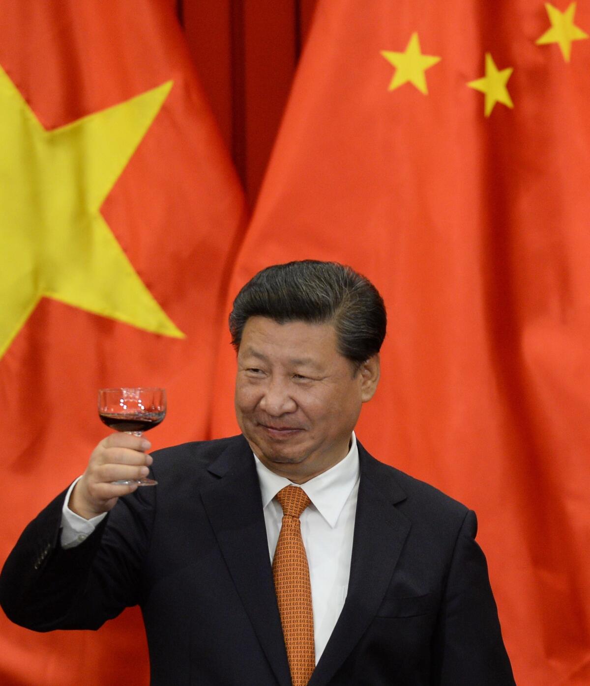 Chinese President Xi Jinping raises a toast with Vietnamese officials in Hanoi on Nov. 5.